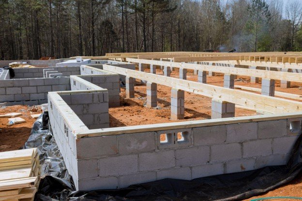 Concrete block foundation with floor framing system installed during new home construction in Medina, OH