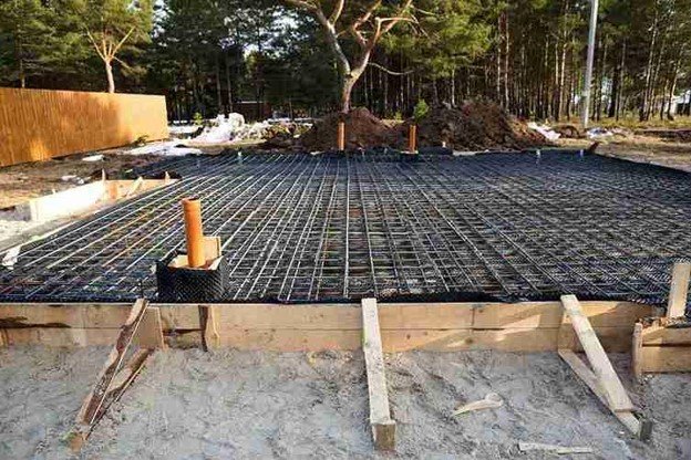 Reinforced concrete slab foundation with steel rebar grid prepared for pouring in Medina, OH