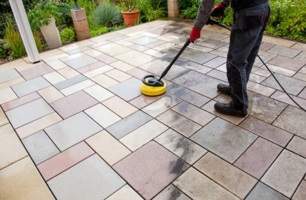 Cleaning and sealing decorative stamped concrete patio surface in residential backyard in Medina, OH