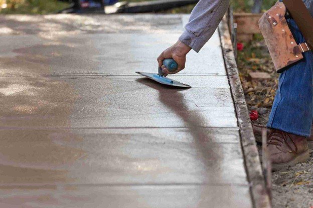 Newly installed concrete driveway with smooth finish and clean layout at residential home in Middleburg Heights, OH